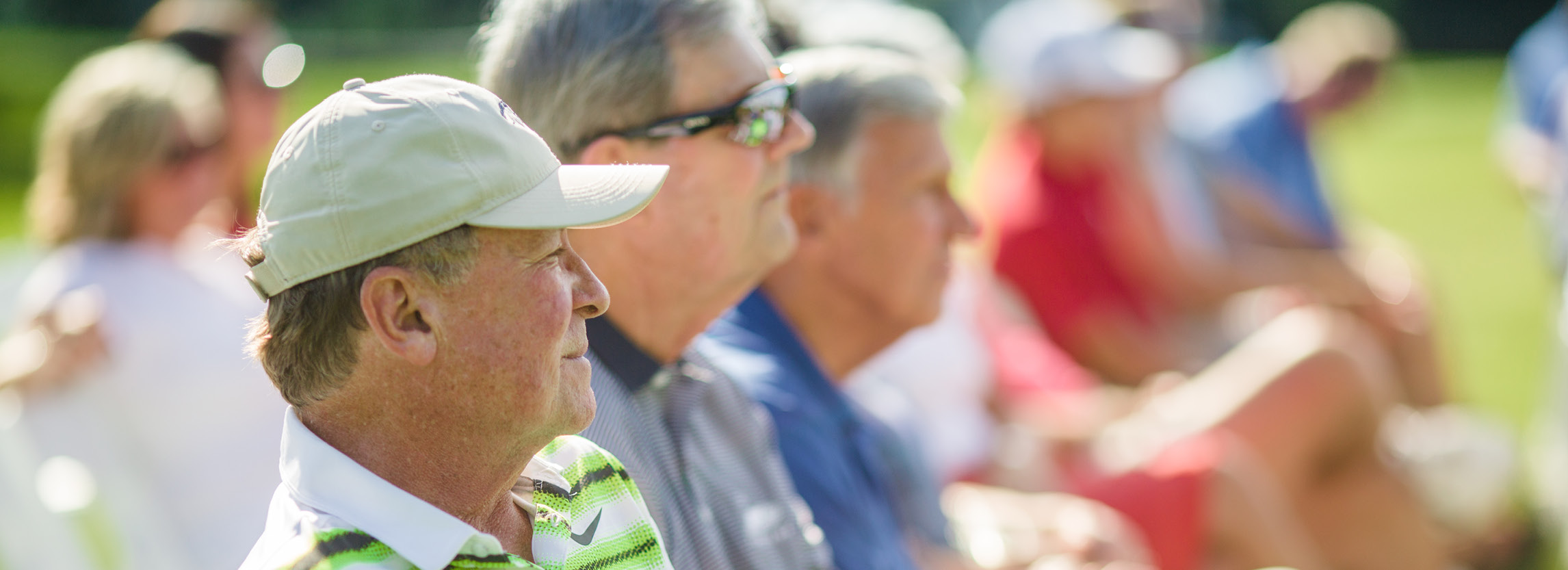 Older gentlemen watching golf